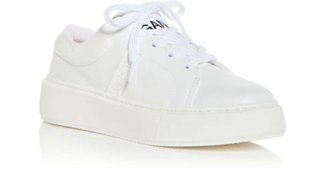 white sporty sneakers low tops